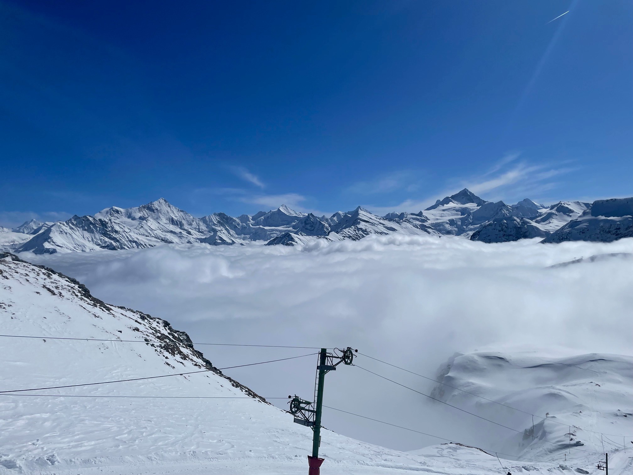 Amazing alps scenery above the clouds when the sun is out