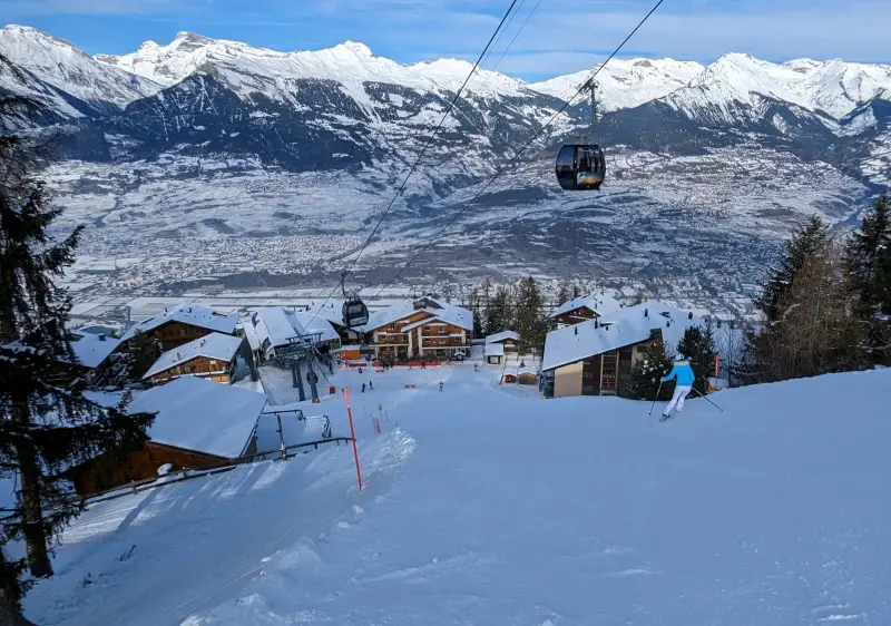 Overlooking the Rhone Valley & Sion, skiing into the Hotel Magrappe at Veysonnaz in 4 Vallees 