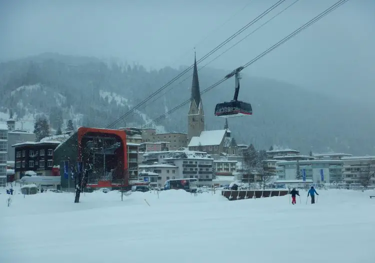 Davos Klosters ski resort. Jakobshorn cable car climbs out of Davos.
