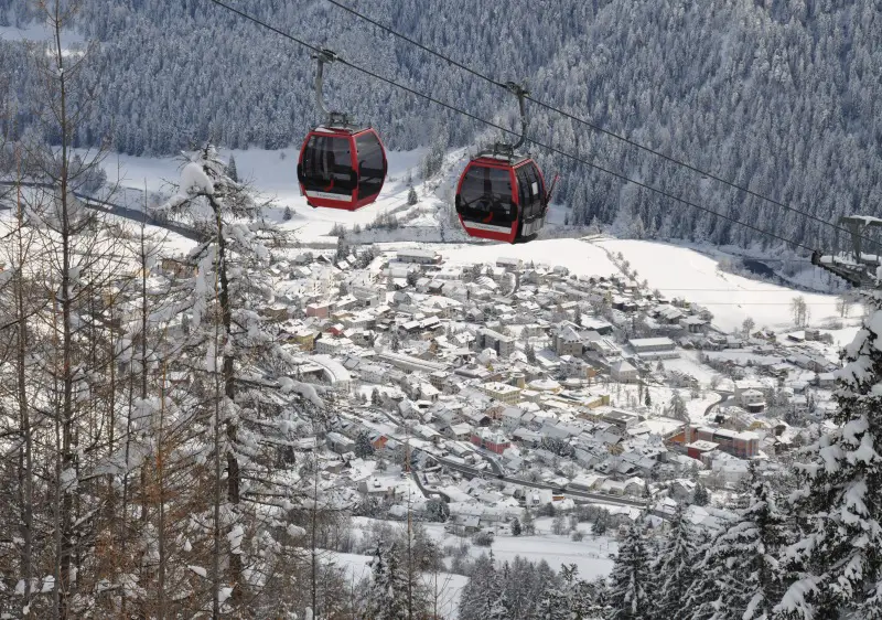 Scuol ski resort rises above the town of the same name in Graubünden Switzerland